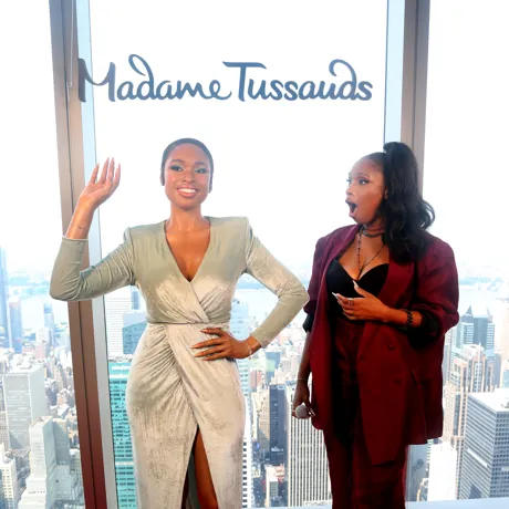 Jennifer Hudson with a shocked expression looking at her wax figure