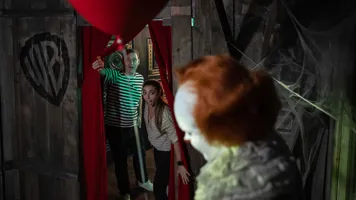 Guests being spooked by a horror icon wax figure