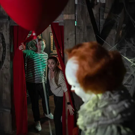 Guests being spooked by a horror icon wax figure
