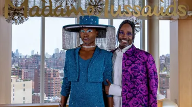 billy porter standing next to his wax figure