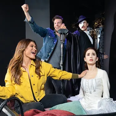 Guests posing with wax figures from Phantom of the Opera