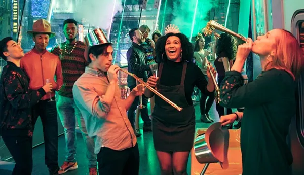 Group of friends celebrating while taking pictures at the World Famous Wax Museum Madame Tussauds New York