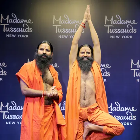 baba ramdev standing next to his wax figure