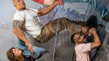 Photo guests posing in the action movie set with Dwayne John's wax figure