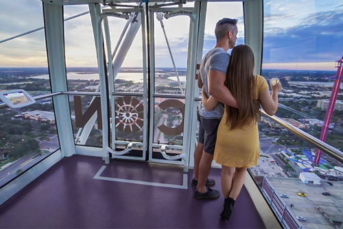 Visitors enjoying a panoramic view from The Wheel at Icon Park