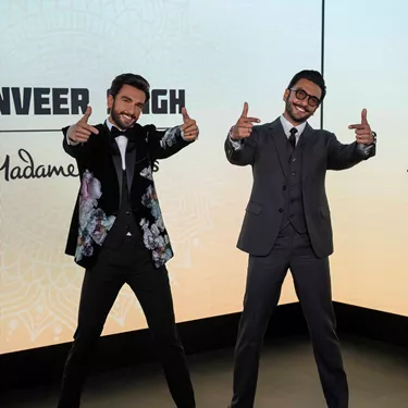 The Bollywood Indian actor and celebrity Ranveer Singh visited his own wax statue at Madame Tussauds, posing beside it with a smile on his face.  