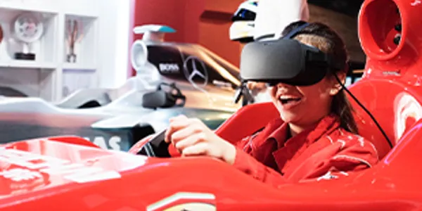 1 out of 5 experiences in Madame Tussauds Singapore. A person experiencing VR Virtual Reality car racing simulation with Lewis Hamilton's team.