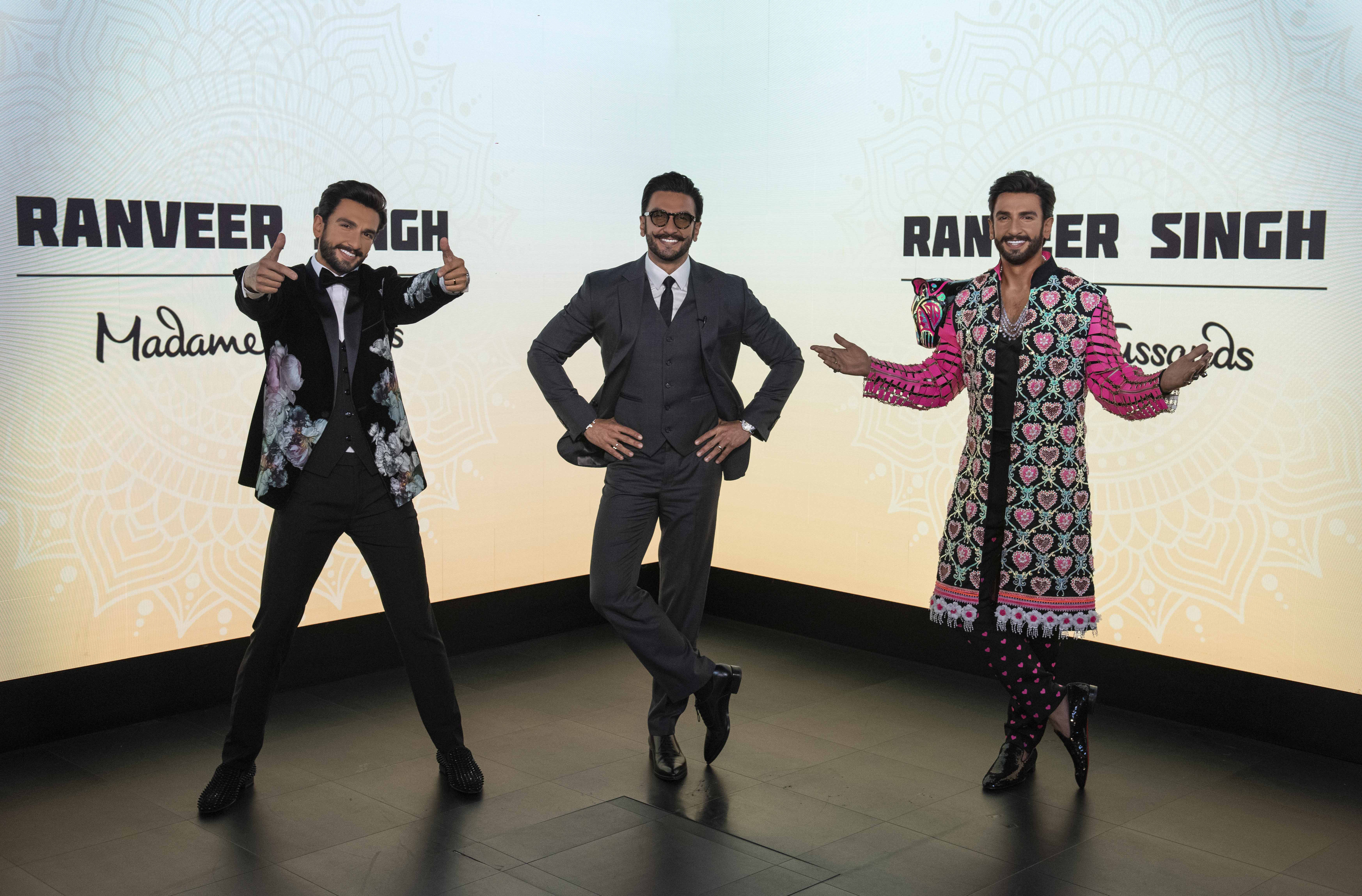 Madame Tussauds features two replicas of Ranveer Singh while the Bollywood actor visited his wax statues, posing with his arms on his hips in the middle of the two figures, creating a challenge to discern the real from the wax.
