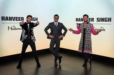 Madame Tussauds features two replicas of Ranveer Singh while the Bollywood actor visited his wax statues, posing with his arms on his hips in the middle of the two figures, creating a challenge to discern the real from the wax.