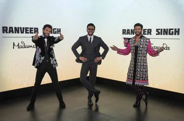 Madame Tussauds features two replicas of Ranveer Singh while the Bollywood actor visited his wax statues, posing with his arms on his hips in the middle of the two figures, creating a challenge to discern the real from the wax.