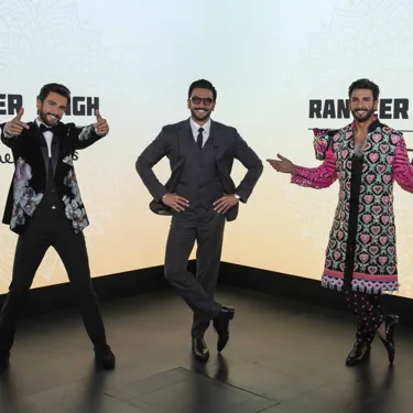 Madame Tussauds features two replicas of Ranveer Singh while the Bollywood actor visited his wax statues, posing with his arms on his hips in the middle of the two figures, creating a challenge to discern the real from the wax.