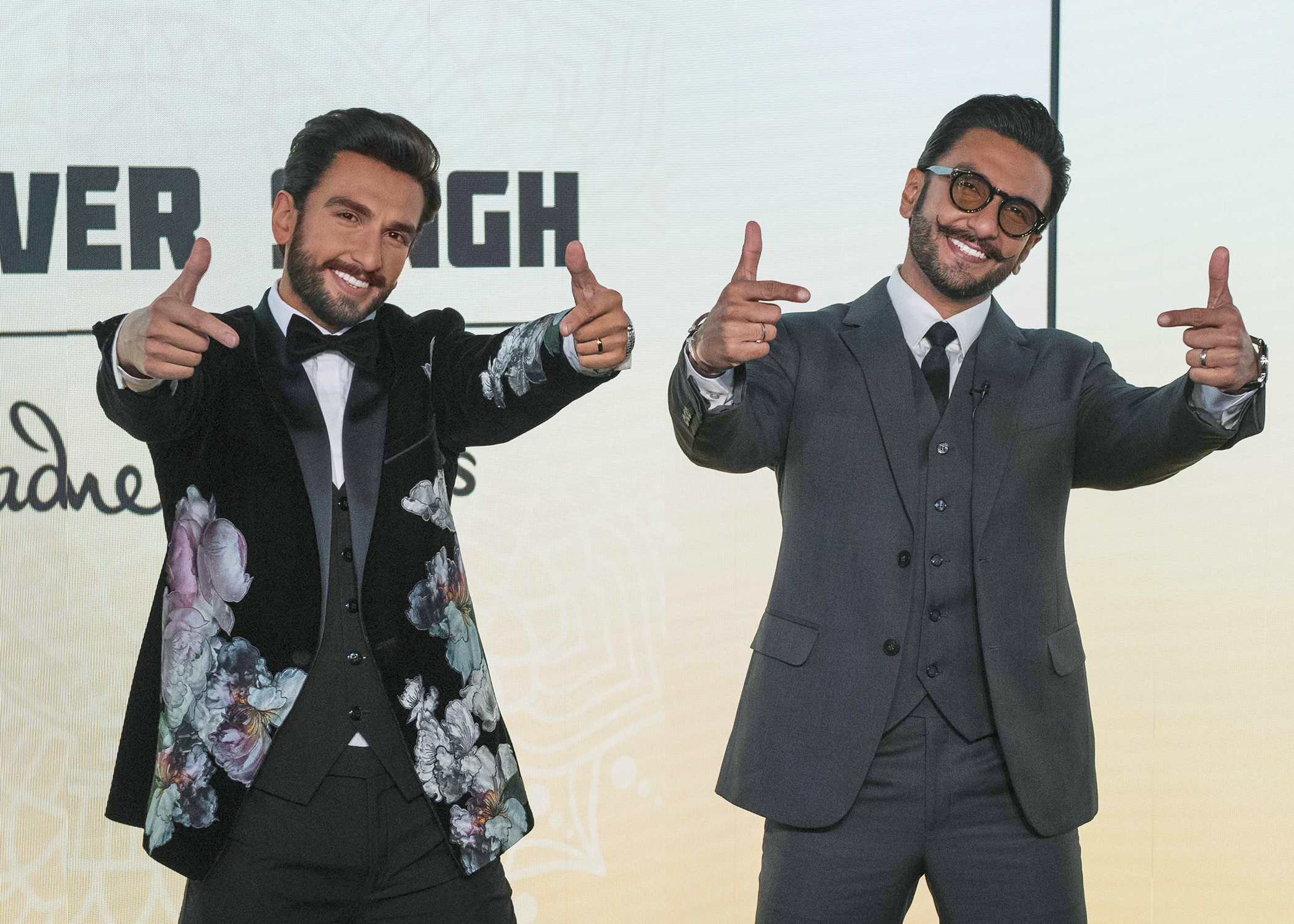 Ranveer Singh's figure donning a gorgeous custom tuxedo featuring a velvet blazer with floral embellishments