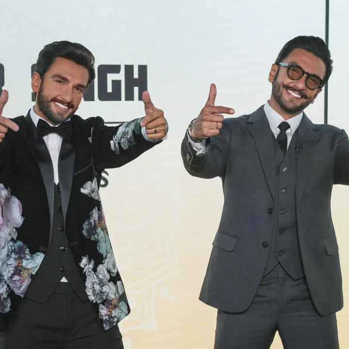 Ranveer Singh's figure donning a gorgeous custom tuxedo featuring a velvet blazer with floral embellishments