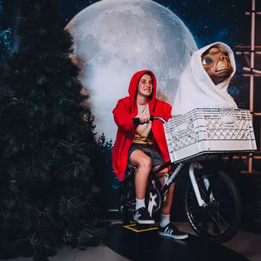 Boy Riding ET's Bike