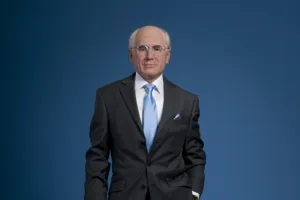 john howard wax work in blue tie