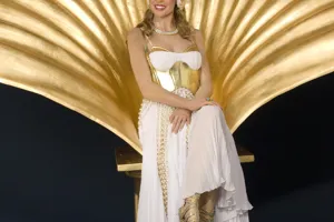 kylie minogue sitting on gold shell