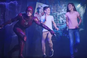 the flash waxwork with 2 children on front of brick wall