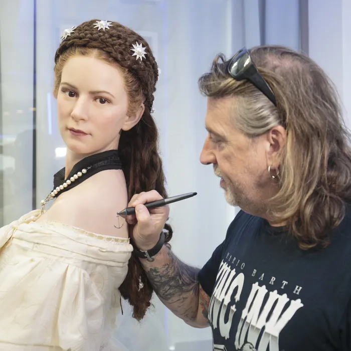 Sisi gets a tattoo by tattoo artist Mario Barth with Madame Tussauds™ Vienna